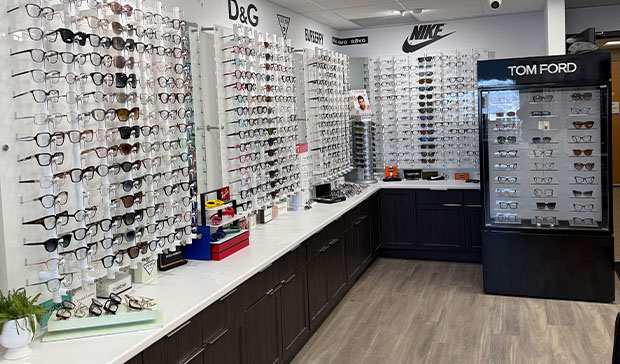 optician helping patient with glasses
