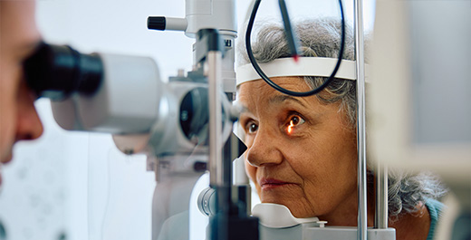 optometrist giving patient Diabetic Eye Exam