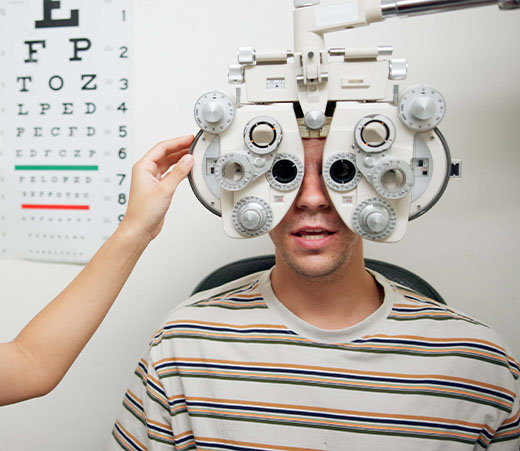 optometrist giving patient eye exam